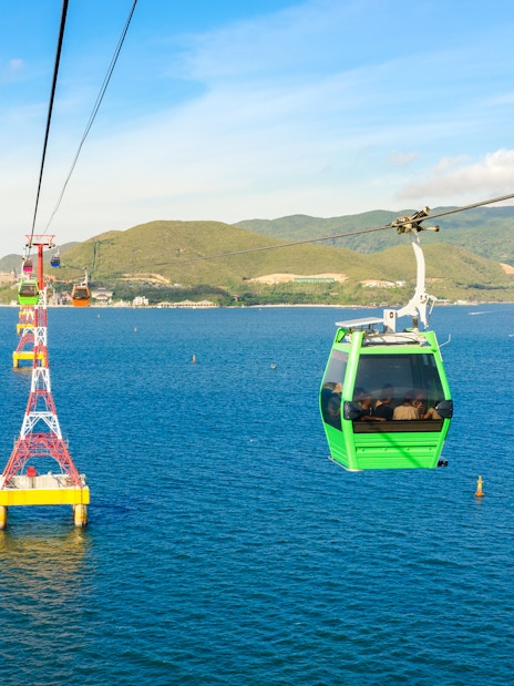 Vinpearl Cable Car over ocean with mountains in Nha Trang, Vietnam.