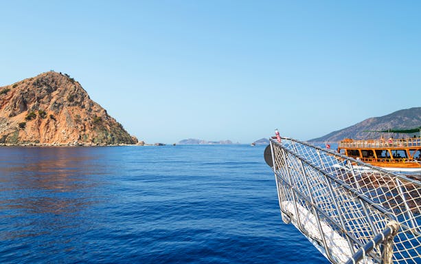 Boat approaching Lower Duden Waterfall on a guided tour in Antalya, Turkey.