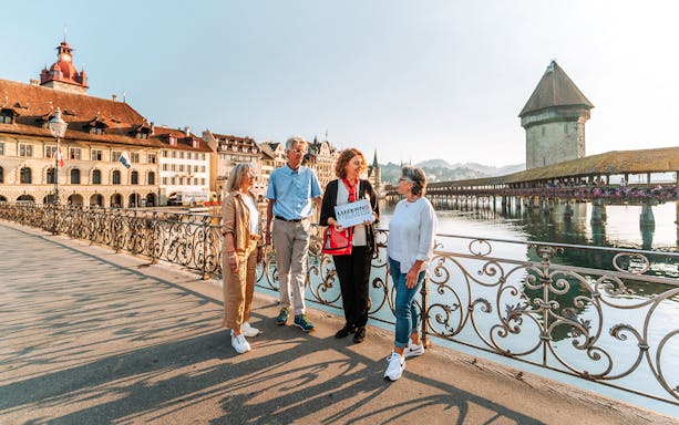 Tour group exploring Jesuit Church, Lucerne with guide