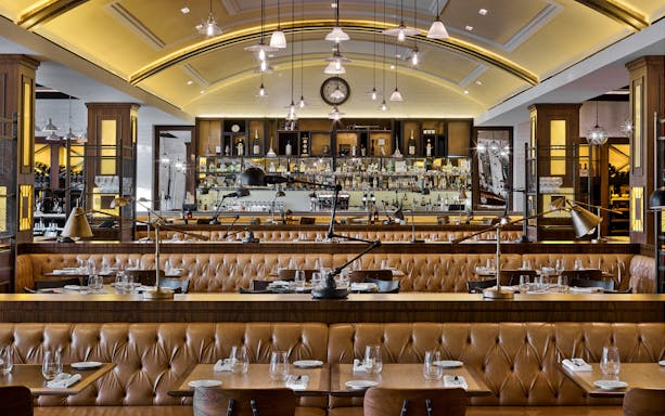 Bread Street Kitchen interior with set tables, Dubai.