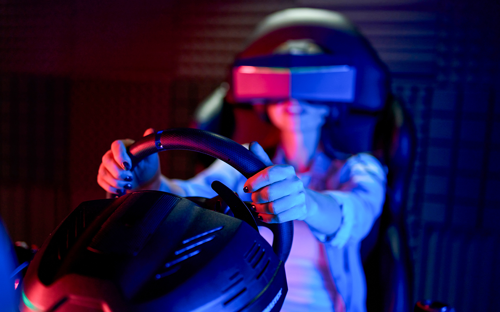 Person using Ferrari GT Simulator at Ferrari Museum.
