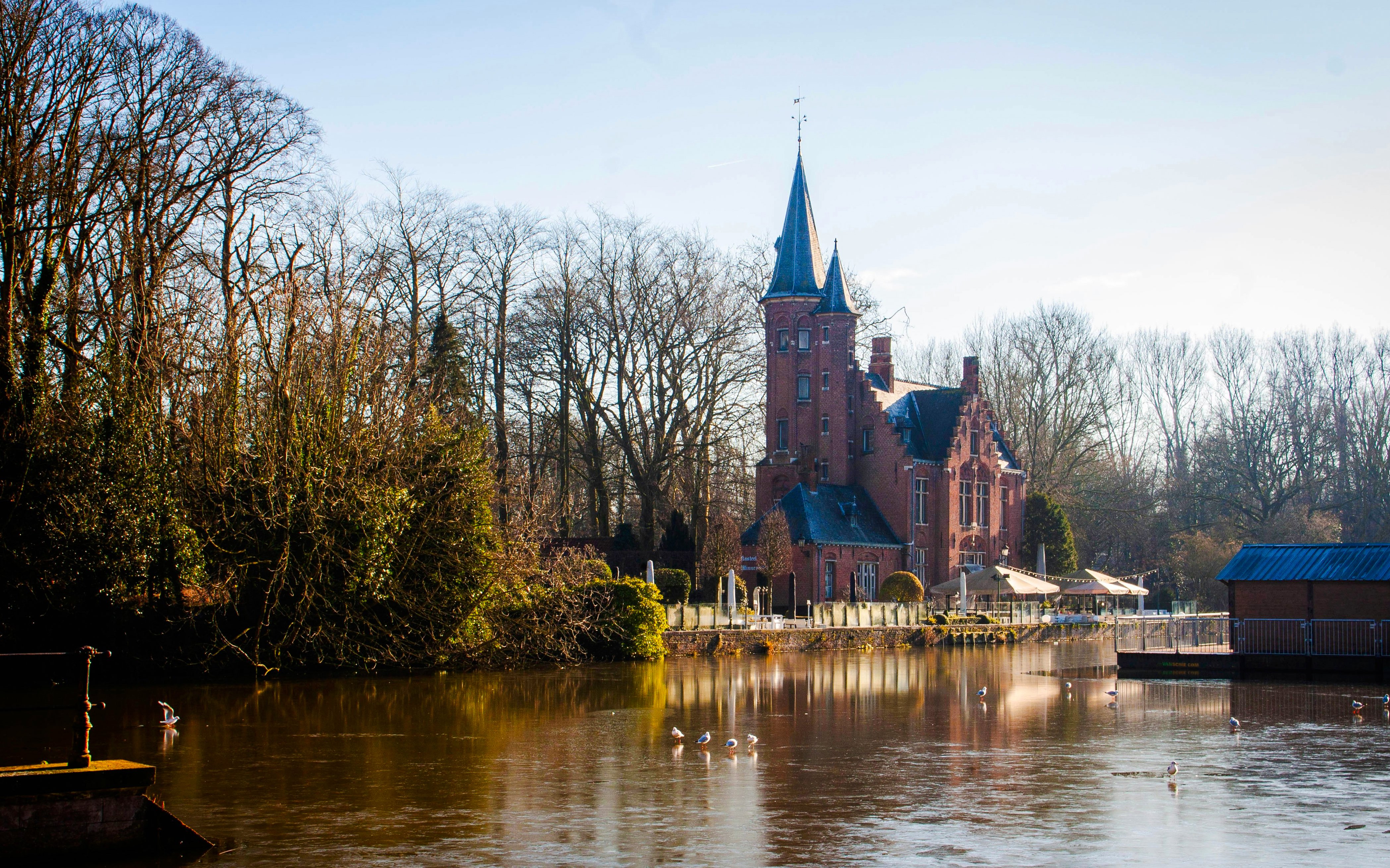 Minnewater Lake with historic building in Bruges, Belgium.