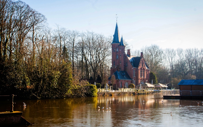 Minnewater Lake with historic building in Bruges, Belgium.