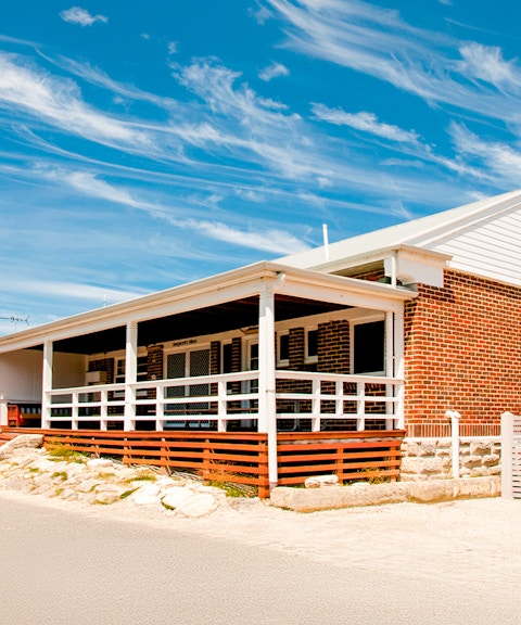 Kingstown Barracks building with red brick and white trim on Rottnest Island, Australia.