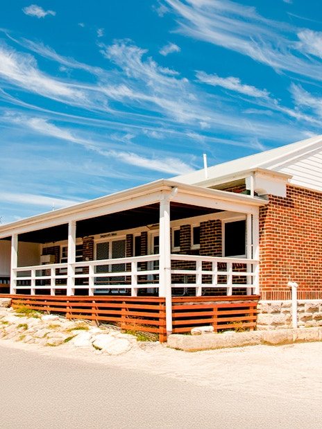 Kingstown Barracks building with red brick and white trim on Rottnest Island, Australia.