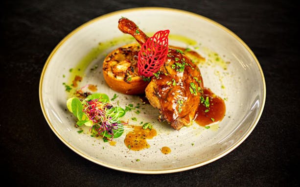 Gourmet dish served on Budapest dinner cruise with live music.