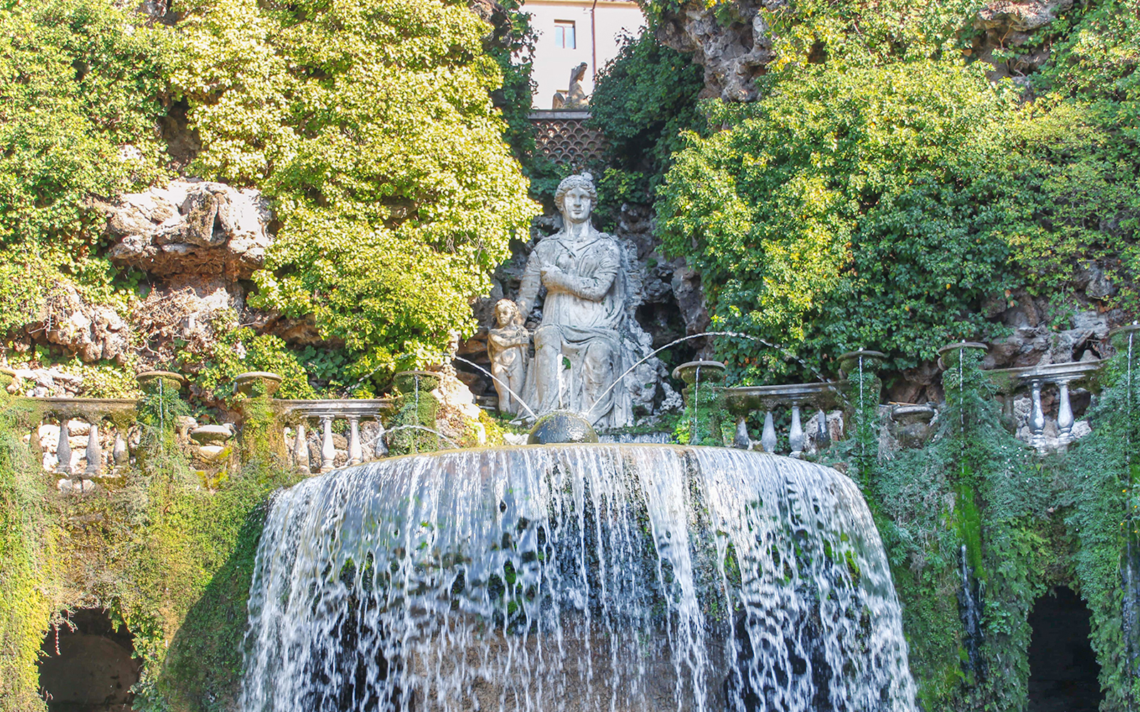 Villa d'Este fountain with cascading water and statue in Tivoli, Italy.