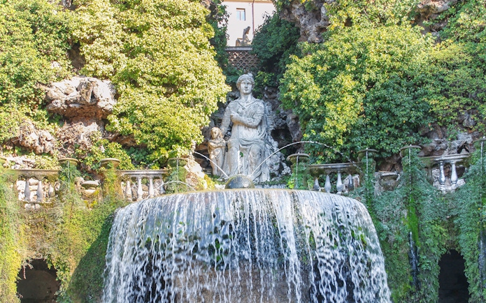 Villa d'Este fountain with cascading water and statue in Tivoli, Italy.