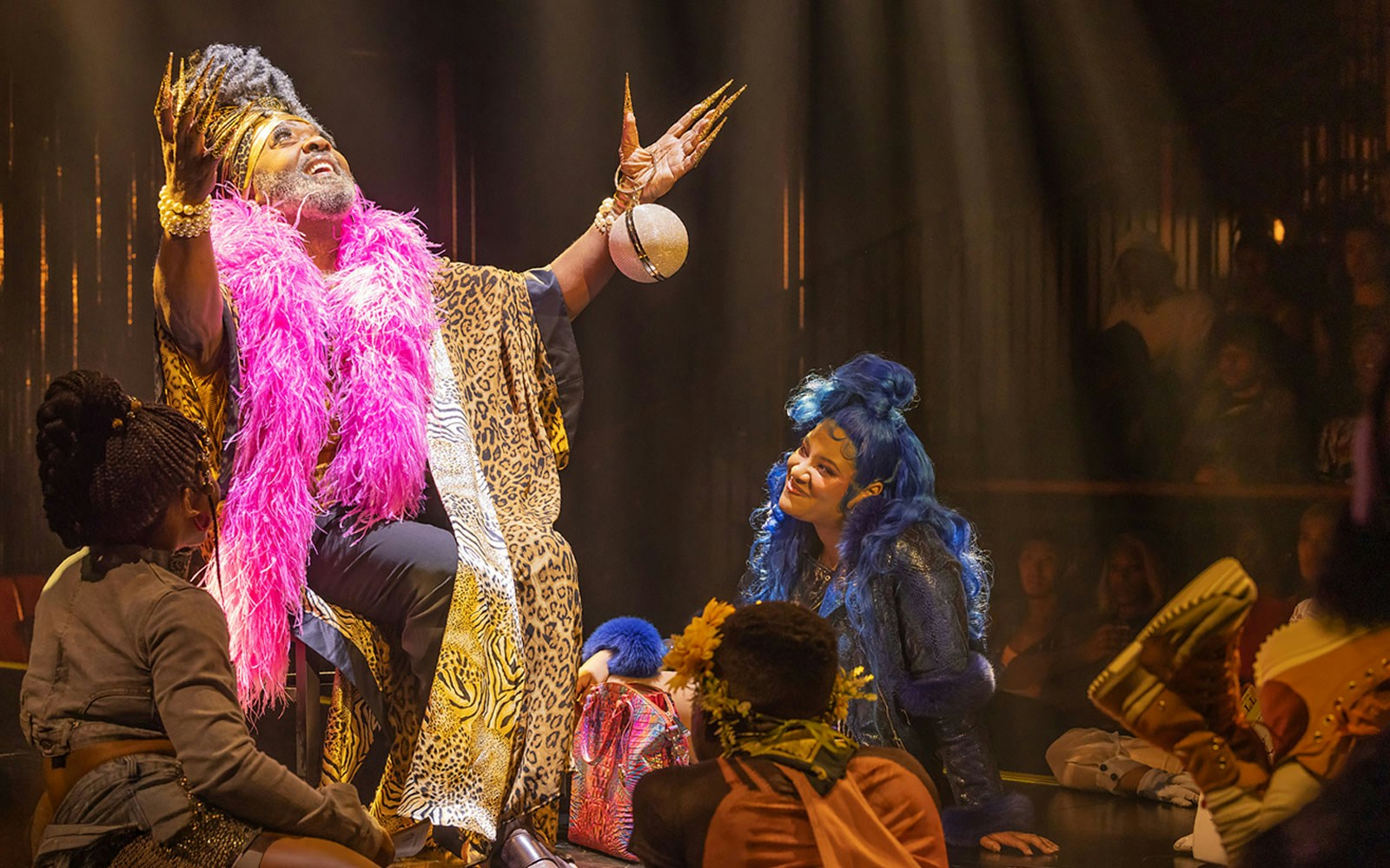 Performer in vibrant costume during CATS: The Jellicle Ball on Broadway stage.