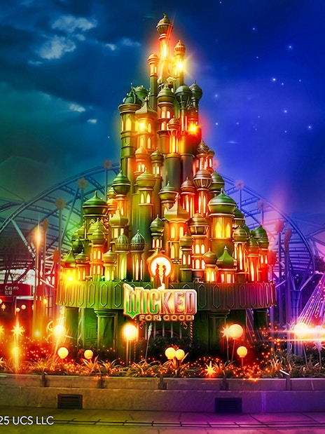 Wicked for Good attraction at Universal Studios Singapore, featuring a vibrant, illuminated castle.