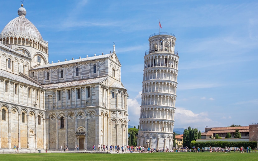 Leaning Tower of Pisa with Pisa Cathedral on the left during a walking tour.