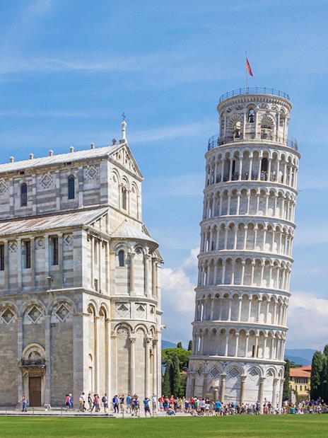 Leaning Tower of Pisa with Pisa Cathedral on the left during a walking tour.