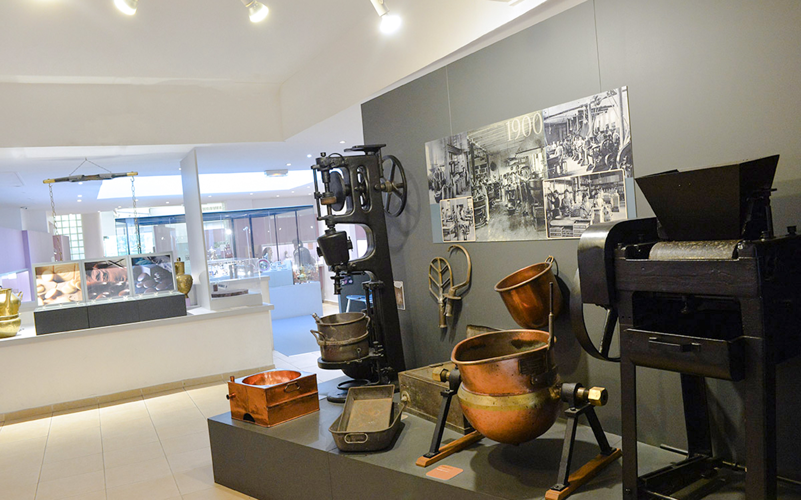 Artifacts and machinery display at Choco-Story Paris museum.