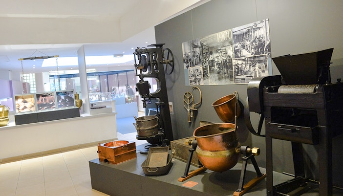 Artifacts and machinery display at Choco-Story Paris museum.