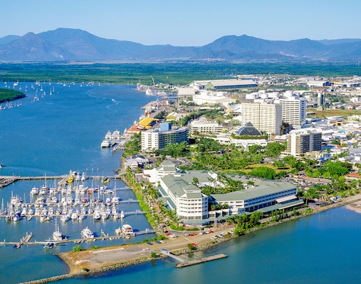 Aerial view of Cairns Reef Fleet Terminal with boats docked along the marina.