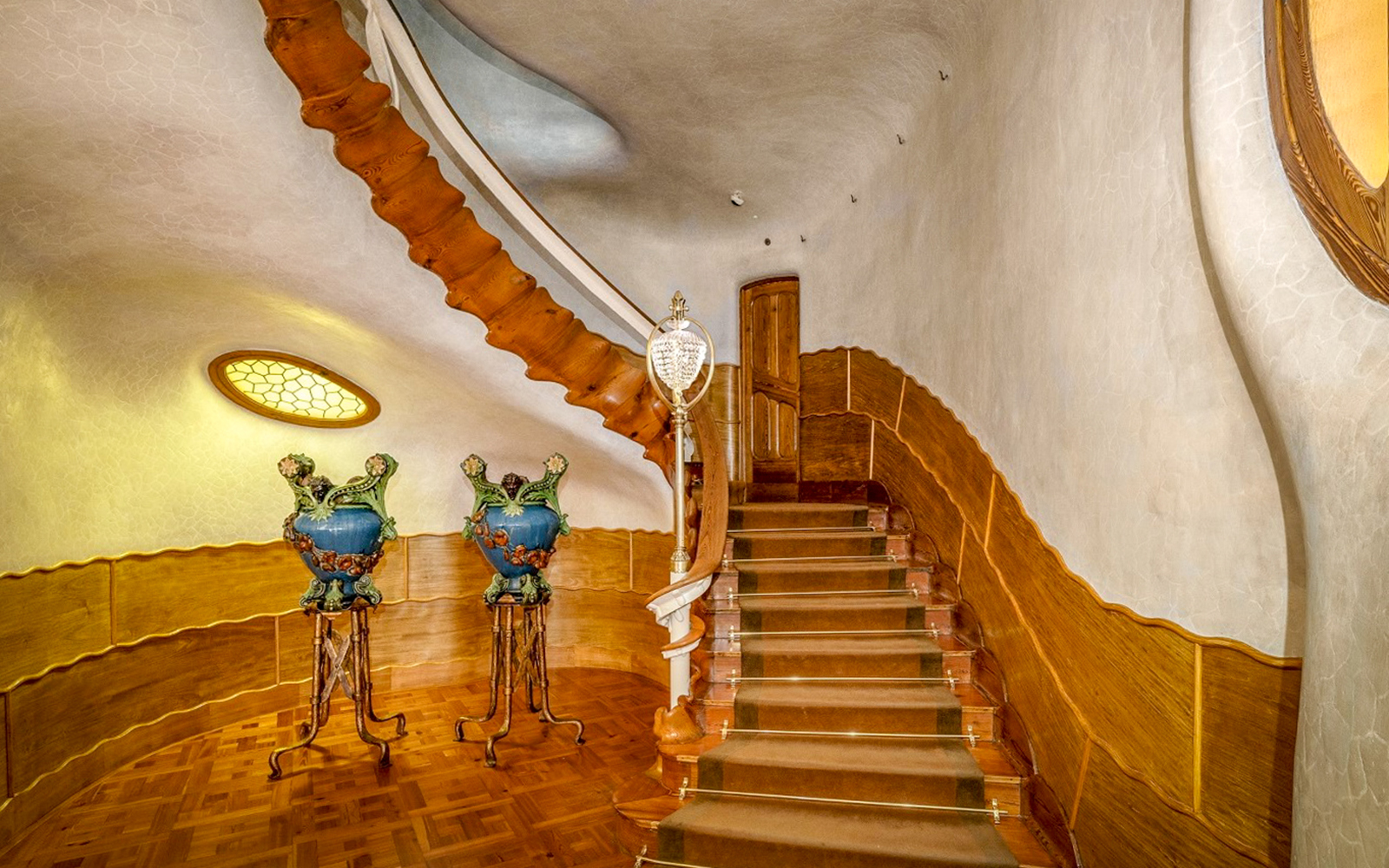 Casa Batlló interior staircase with ornate vases, Barcelona.