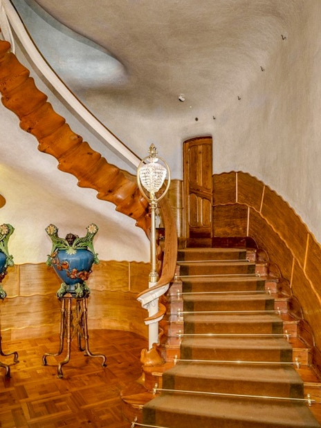 Casa Batlló interior staircase with ornate vases, Barcelona.