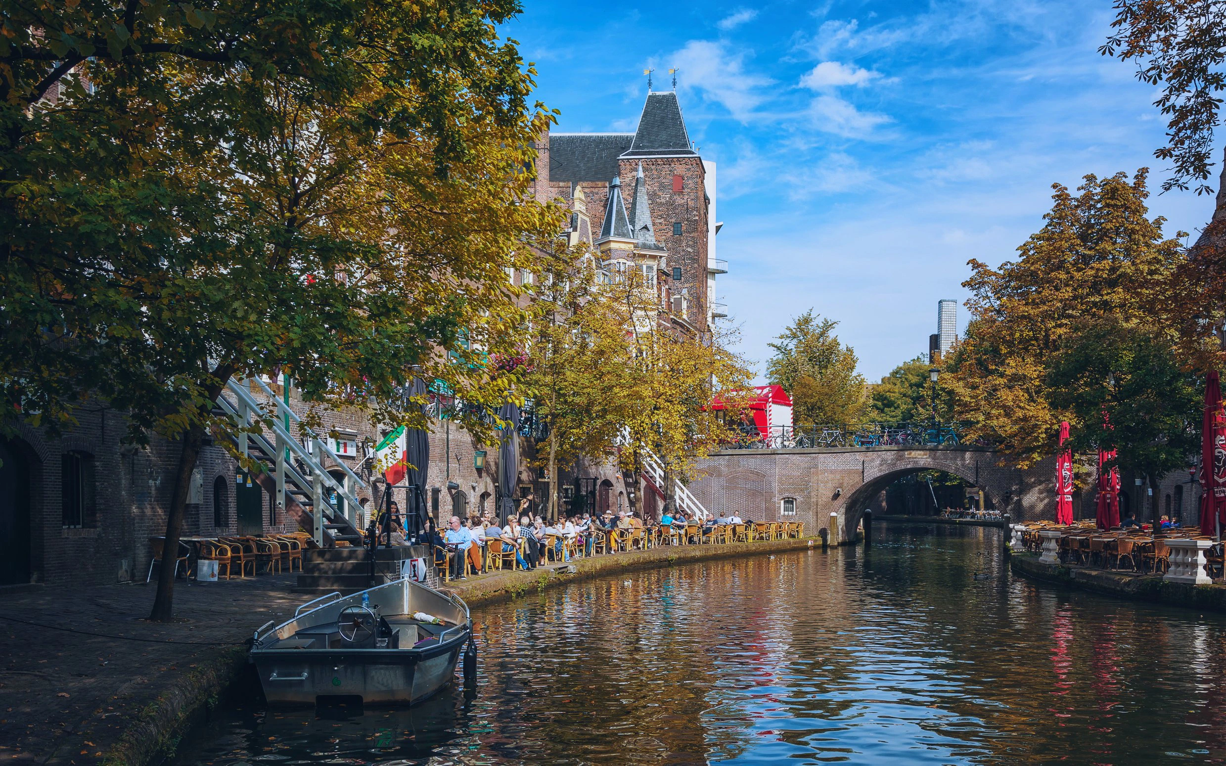 Canal-side cafes and historic buildings along Oudegracht in Utrecht.