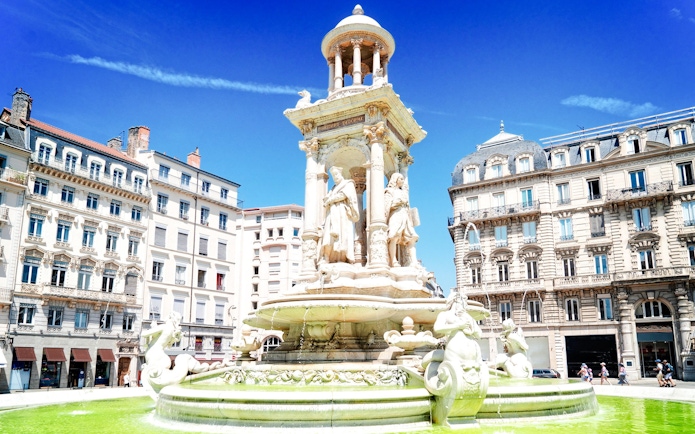 Fountain in front of historic buildings near the Museum of Fine Arts, Lyon, France.