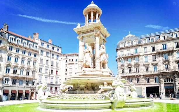 Fountain in front of historic buildings near the Museum of Fine Arts, Lyon, France.