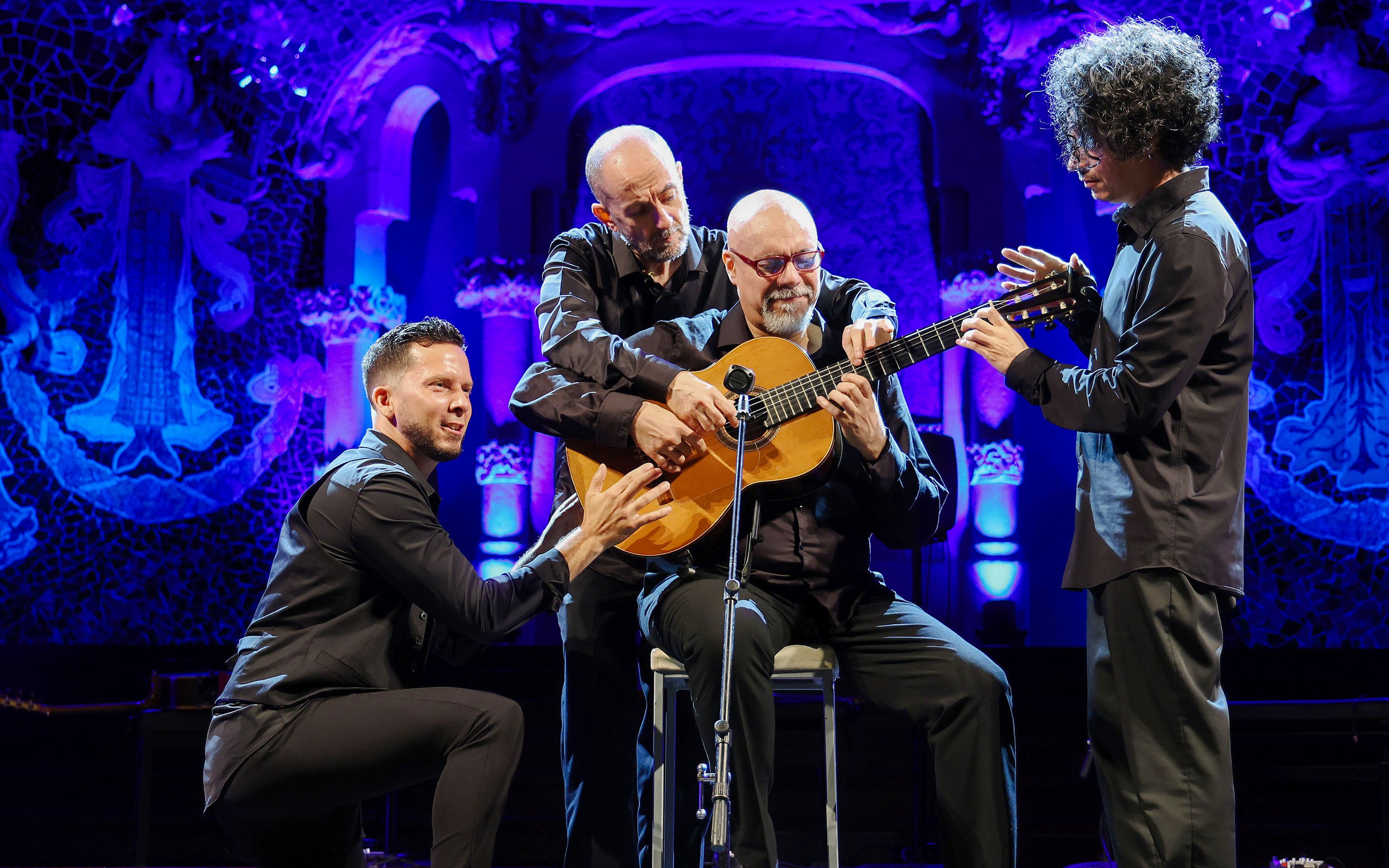 Flamenco artists performing with guitars at Barcelona Guitar Trio & Flamenco Dance event.