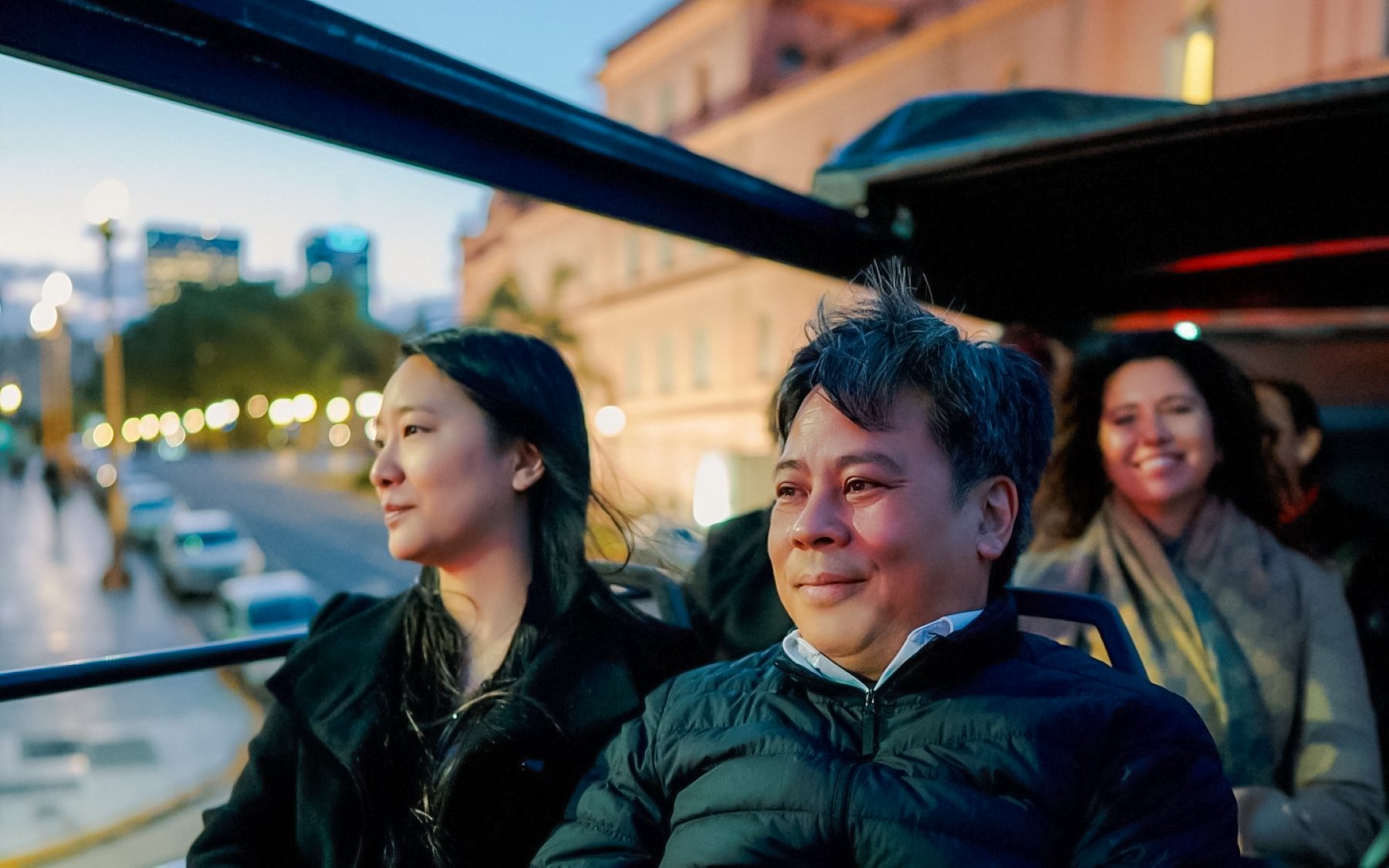 Passengers enjoying a night bus tour in Buenos Aires, exploring myths and legends.