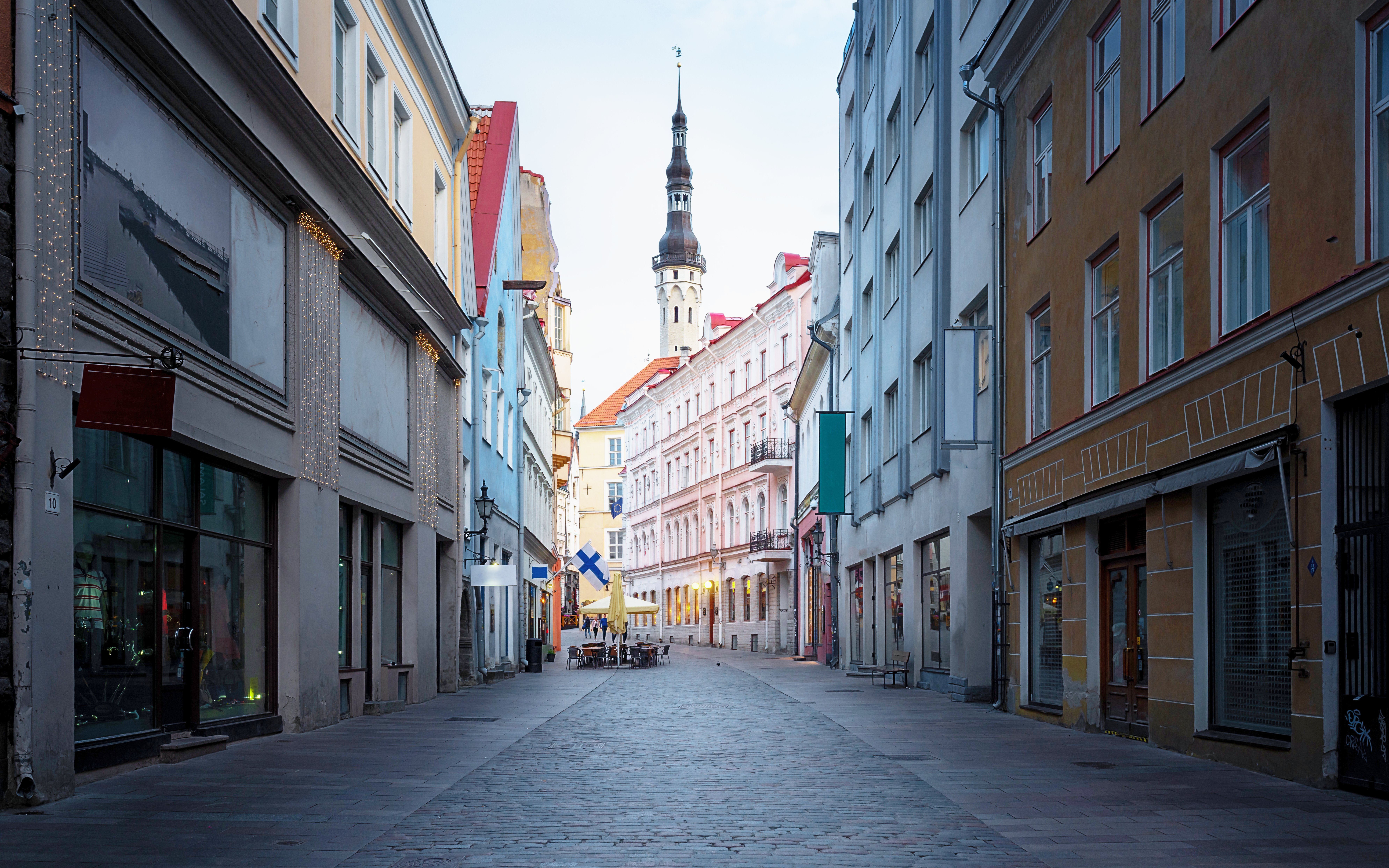 Viru Street in Tallinn old town with Town Hall Tower in background, Estonia.