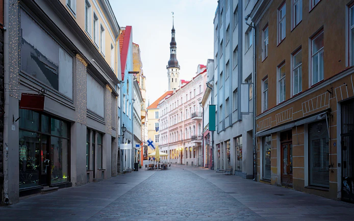 Viru Street in Tallinn old town with Town Hall Tower in background, Estonia.