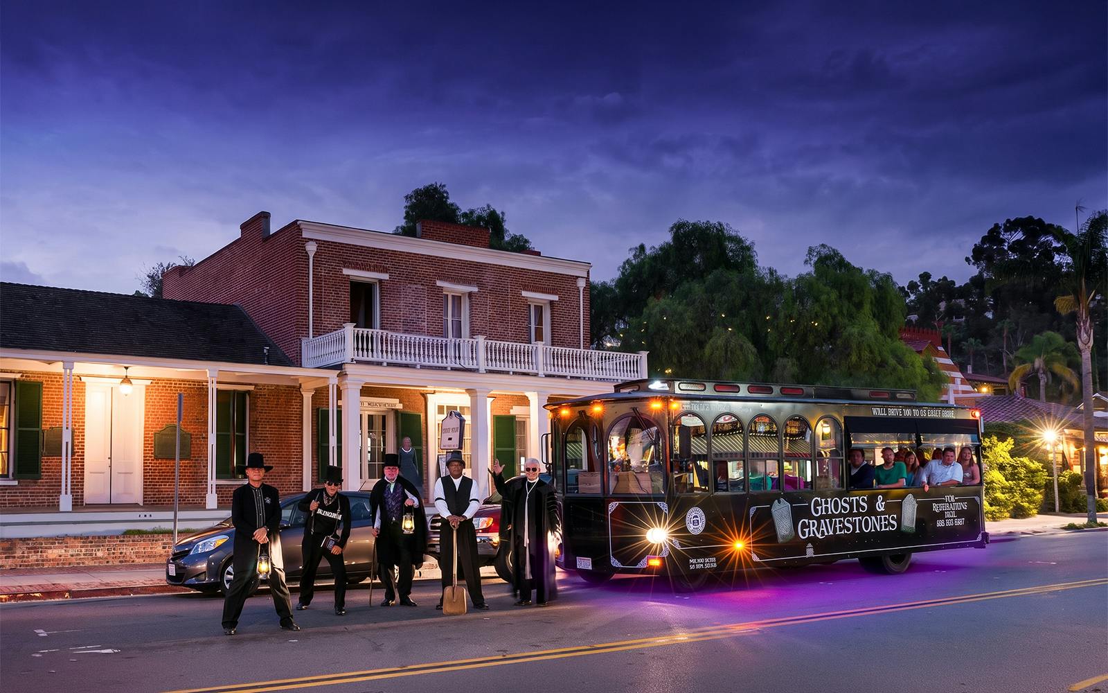 San Diego Ghosts & Gravestones tour trolley with guides in period costumes at night.