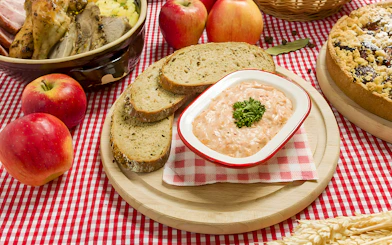 Cheese spread with bread slices at Folklore Dinner Show.