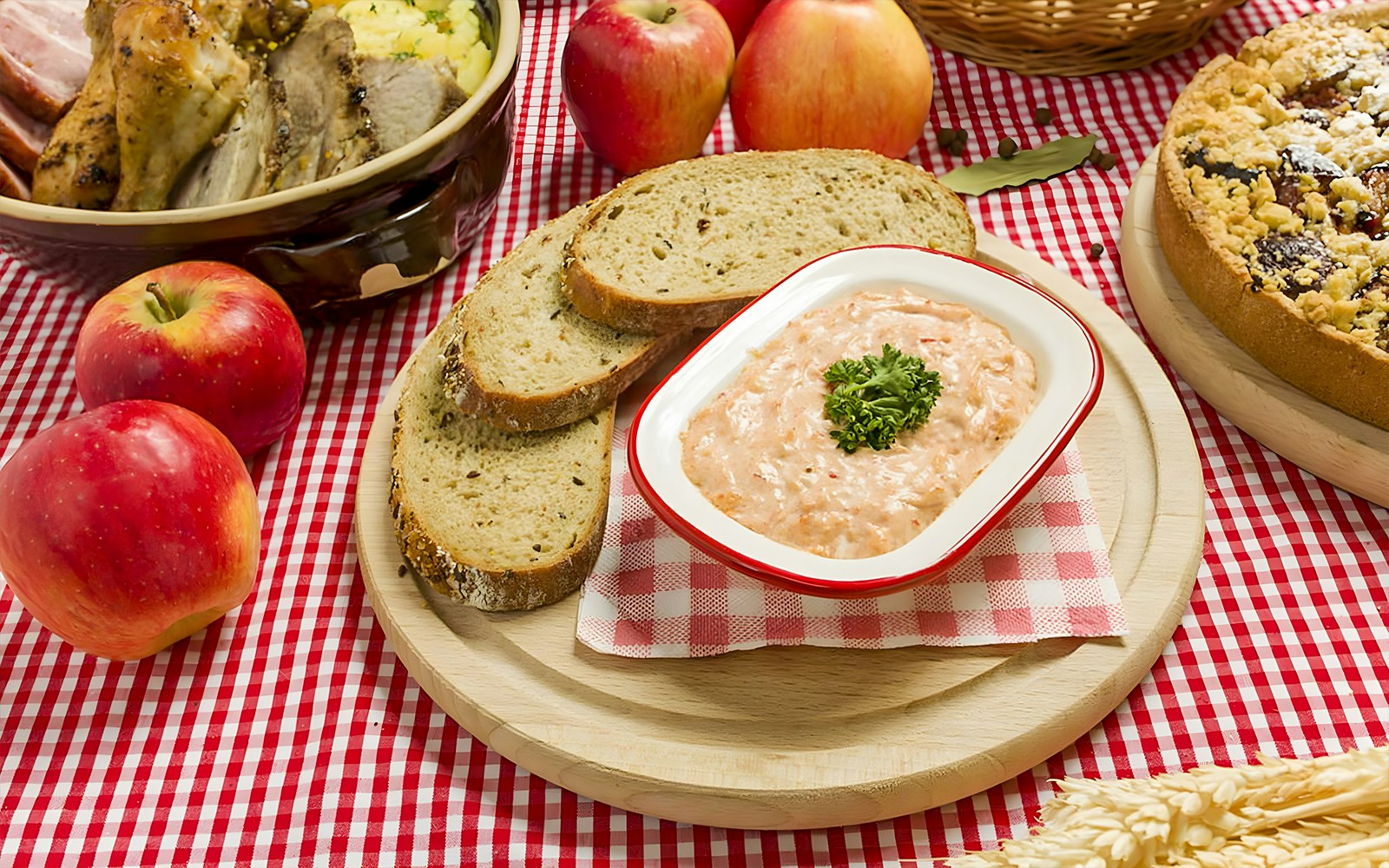 Cheese spread dishes at Prague Folklore Dinner Show with traditional Czech decor.