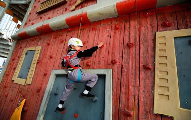 Child climbing wall at CITY STUDIO, Angry Birds World Theme Park.