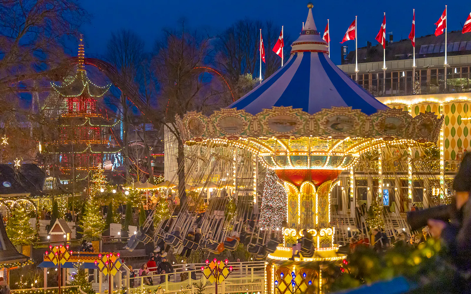 Carousel ride illuminated at night during Christmas in Tivoli Gardens, Copenhagen.