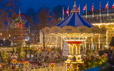 Carousel ride illuminated at night during Christmas in Tivoli Gardens, Copenhagen.