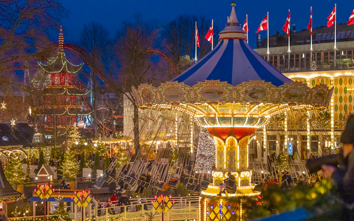 Carousel ride illuminated at night during Christmas in Tivoli Gardens, Copenhagen.
