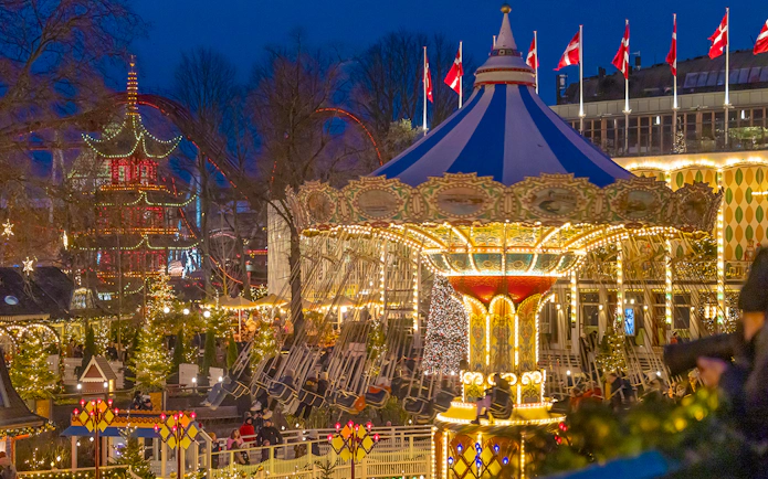 Carousel ride illuminated at night during Christmas in Tivoli Gardens, Copenhagen.