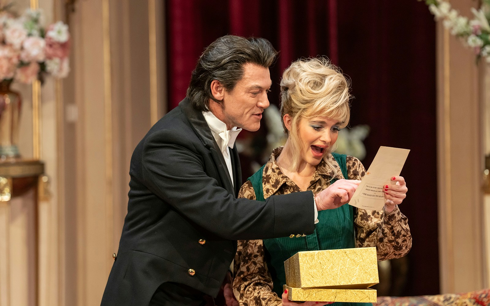 Man and woman reading a letter together, holding a gold box, related to Backstairs Billy.