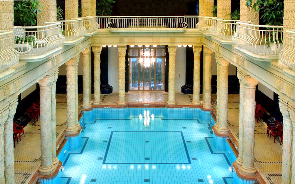 Indoor pool with ornate columns at Gellert Spa, Budapest.
