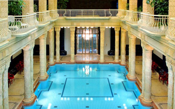 Indoor pool with ornate columns at Gellert Spa, Budapest.
