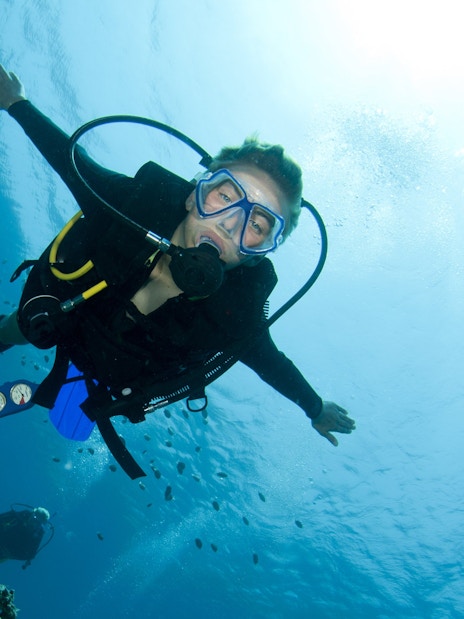 Scuba diver exploring coral reefs in the Red Sea, Hurghada.