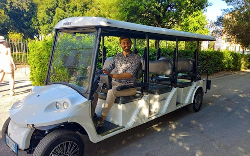 Golf cart with driver on Villa Borghese tour in Rome.