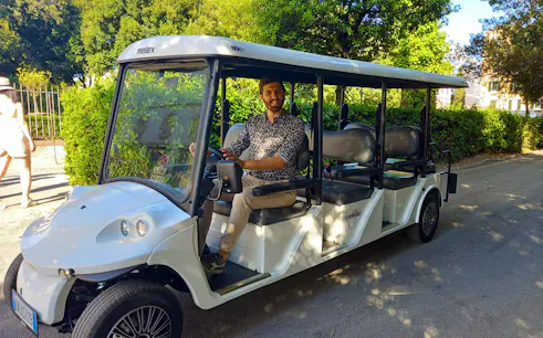 Golf cart with driver on Villa Borghese tour in Rome.
