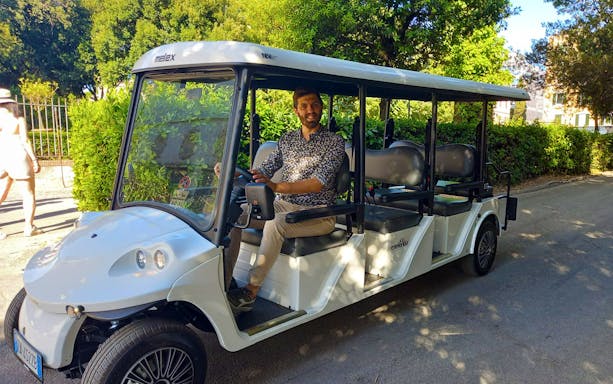 Golf cart with driver on Villa Borghese tour in Rome.