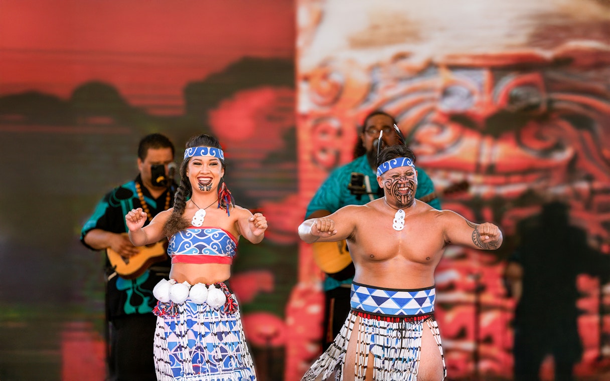 Performers in traditional attire at Moana Luau, Hawaii.