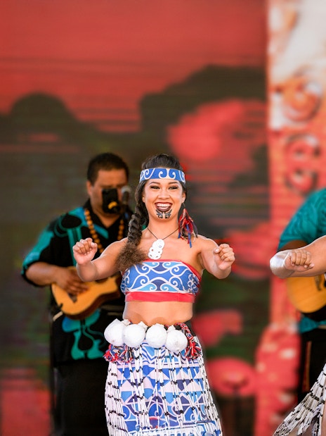 Performers in traditional attire at Moana Luau, Hawaii.