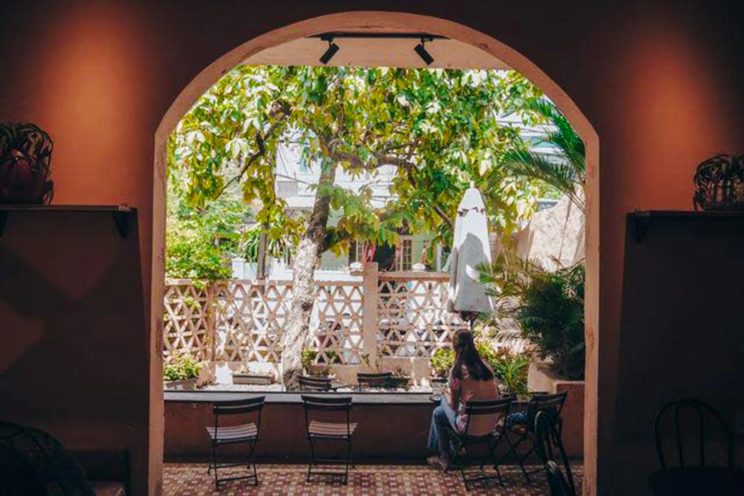 Outdoor cafe view with lush greenery, Da Nang Coastal Charm Half-Day Cafe Tour.