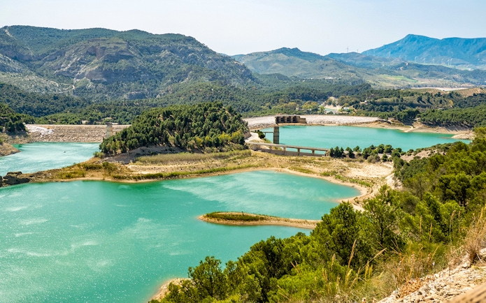 Caminito del Rey landscape with turquoise lakes and surrounding mountains in Málaga, Spain.