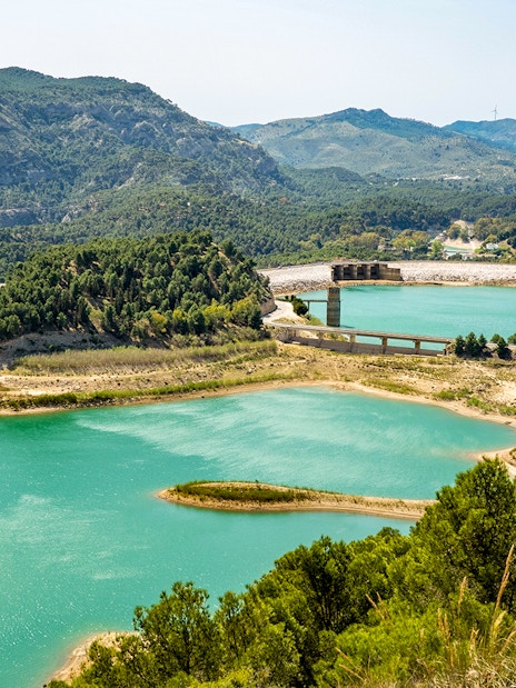Caminito del Rey landscape with turquoise lakes and surrounding mountains in Málaga, Spain.