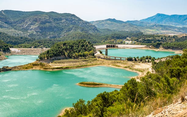Caminito del Rey landscape with turquoise lakes and surrounding mountains in Málaga, Spain.