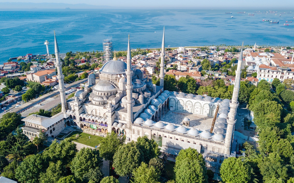 Aerial view of the Blue Mosque Sultanahmet with minarets in Istanbul, overlooking the sea.